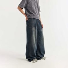 Elevate your style with our Dark Blue Wide Leg Jeans. Unisex baggy denim pants crafted for both comfort and trendiness. Shop now for the perfect blend of fashion! Baggy High Waist Casual Jeans, Casual Dark Wash Relaxed Fit Bottoms, Casual Dark Wash Washed Bottoms, Casual Dark Wash Bottoms, Casual Dark Wash Tapered Leg Bottoms, Casual Faded Tapered Leg Bottoms, Casual Oversized Straight Leg Cargo Jeans, Oversized High Rise Casual Bottoms, Baggy High Rise Casual Jeans