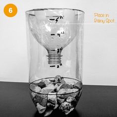 an image of a light bulb in a glass vase filled with rocks and ice cubes