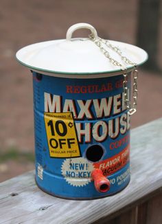 a blue bucket with a chain hanging from it