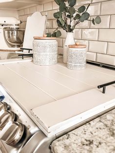 the kitchen counter is clean and ready to be used as a planter or pot holder