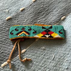 a beaded object is laying on the ground