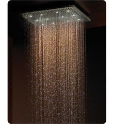 a shower head with water running down it's sides and lights on the side