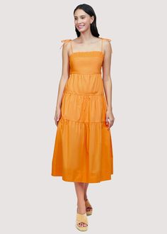 Get ready to turn heads in our Paradiso Midi Dress! Made from soft cotton poplin in a beautiful apricot shade, this dress is a true sun dress silhouette. Its relaxed fit and easy midi length make it the perfect choice for sunny days. Complete your look with sandals and a sun hat. WDWH23282 Imported Lined Self: 100% CottonLining: 100% Rayon Model is 5 ft 9.5 inches; Bust: 32", Waist: 24", Hips: 34" and wearing a size Small Runs true to size Hand wash or wash with gentle cycle with cold water with like colors, Air dry to avoid shrinkage Solid Cotton Midi Dress For Beach, Solid Cotton Sundress For Spring, Cotton Midi Sundress For Brunch, Cotton Midi Dress For Summer, Solid Spring Midi Sundress, Solid Color Summer Midi Dress For Daywear, Solid Summer Cotton Maxi Dress, Solid Color Midi Length Sundress For Spring, Solid Cotton Summer Maxi Dress