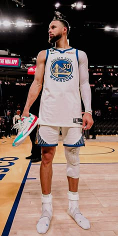 a man standing on top of a basketball court