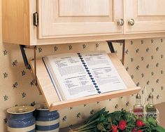 an open book on top of a wooden cabinet