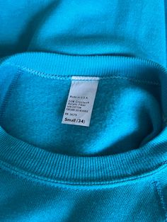 Classic blank solid blue long raglan sleeve crew neck pullover with ribbing on the hem, collar, and sleeve cuffs. In excellent vintage condition / no visible flaws. DETAILSMade in USAMaterial: 50% Creslan Acrylic Fiber, 50% Cotton SIZE & MEASUREMENTSTag Size: Small Length: 35"Bust: 32"Waist: 32"Sleeve: 24"Shoulder: 17" Plain Stretch Crew Neck Sweater, Blue Crew Sweatshirt With Ribbed Collar, Blue Crew Neck Sweater With Ribbed Cuffs, Blue Cotton Raglan Sleeve Sweatshirt, Blue Relaxed Fit Sweatshirt With Raglan Sleeves, Blue Crew Neck Sweatshirt With Ribbed Cuffs, Basic Blue Crew Neck Sweatshirt, Basic Blue Sweatshirt With Ribbed Cuffs, Blue Long Sleeve Sweatshirt With Ribbed Cuffs