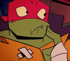 an animated image of a teenage mutant wearing a red and green helmet with one hand on his face