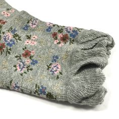 Walk into a flower garden with these floral socks. Each pair of socks features a unique flora design with a ruffle at the top. The socks consist of a cotton blend for extra comfort and breathability. Great for casual wear under trousers. Sold as a set of 5 pairs of socks. Dimensions: Palm of foot 6.5 inches, Height 5 inches. Material: 35% Cotton, 65% Polyester. Washing Instructions: Hand wash in cold water. Do not bleach. Do not wring. Comfortable Cotton Socks For Spring, Casual Floral Print Socks For Spring, Gray Casual Socks For Spring, Casual Gray Socks For Spring, Trendy Gray Socks For Spring, Trendy Soft Socks For Spring, Fashion Apron, Earring Jewelry Box, Floral Socks