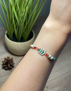 TITLE: Christmas Tree Bracelet, Pine Tree Bracelet, Christmas Bracelet, Adjustable Wish Bracelet, Secret Santa Gift,Christmas Gift,Holiday Bracelet W I S H   B R A C E L E T Close your eyes and make a wish, put this bracelet on your wrist. When the bracelet breaks in two, then your wish may come true. Cute Christmas tree bracelet with adjustable cord and zinc alloy Christmas tree charm. It is perfect as Christmas gift. Adjustable sliding knot allows you to create a personalized fit.  Minimum length of the bracelet is 7.09 inches and the maximum is 11.02 inches. Adjustable Christmas Charm Bracelet For Gifts, Adjustable Charm Bracelet For Christmas Gift, Holiday Gift Charm Bracelet Adjustable, Multicolor Christmas Gift Bracelets, Adjustable Christmas Friendship Bracelets, Christmas Friendship Adjustable Bracelets, Adjustable Beaded Bracelet Christmas Gift, Adjustable Bracelets For Christmas Holiday, Adjustable Bracelet For Christmas Gift