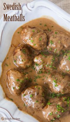 swedish meatballs with gravy in a white bowl