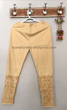 Comfortable and stretchable cotton ankle length pants with Lucknow Chikankari. This beautiful hand embroidered pants can be worn on any kurtis/ tunics. Cool and comfy ! Has a great stretch, fits most. Length:37.5 inches apprx Inseam- 26 inches apprx Embroidery designs may vary. Traditional Ankle-length Cotton Sets, Cotton Festival Bottoms, Non-stretch Embroidered Cotton Pants, Fitted Cotton Bottoms For Festivals, Traditional Cotton Ankle-length Kurta, Traditional Ankle-length Cotton Kurta, Traditional Cotton Stretch Bottoms, Fitted Cotton Churidar For Spring, Traditional Stretch Cotton Bottoms