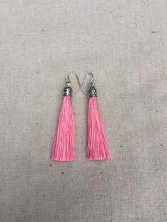 "Chic pink tassel earrings! They would add a pop of color to any outfit for any occasion. Dress them up or down. They are timeless and versatile. They are lightweight, fun and unique! The tassels measure 2 1/8\" long by 1/4\" wide. They hang from simple silver ear wire hooks. Overall drop length is about 2 1/4\". Metal is allergy free plated silver. These are my latest creation! I have them available in many colors! Find them all under the category tassel earrings in my shop. Thanks for stopping Pink Tassel Drop Earrings, Adjustable Pink Tassel Drop Earrings, Pink Tassel Earrings For Summer Gifts, Pink Tassel Earrings As Gift, Pink Tassel Jewelry As A Gift, Trendy Pink Tassel Earrings, Trendy Pink Tassel Jewelry, Pink Dangle Tassel Earrings With Fringe, Pink Fringe Tassel Dangle Earrings