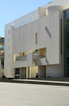 a large white building sitting next to a street