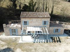 an aerial view of a house in the countryside