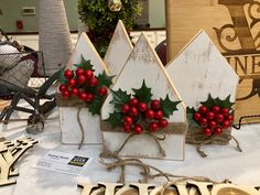 christmas decorations are displayed on a table