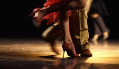 the legs and feet of two people dancing