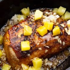 the meal is prepared and ready to be eaten in the crockpot with pineapples on top