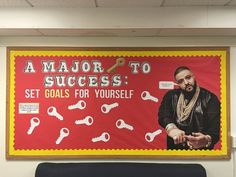 a bulletin board with a man holding keys in front of him and the words, a major to success set goals for yourself