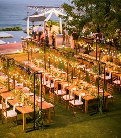 an outdoor wedding venue set up with tables and chairs