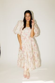 this vintage-inspired puff sleeve midi dress is a zoco hunny essential. featuring a soft spring floral pattern with a slimming smocked bodice + dreamy puff sleeves, it’s the perfect formal dress for brunch dates, garden parties, + bridal showers. pink + sage floral // midi length, square neck, smocked, puff sleeve, pockets, back zipper, fully lined, organza model is 5'8" + wearing a small measurements are approximate + taken while laying flat small : bust 34” (smocked) length 48” medium : bust 3 Dress For Brunch, Brunch Dates, Soft Spring, Puff Sleeve Midi Dress, Puff Sleeve Dress, Garden Parties, Dress Spring, Puffed Sleeves Dress, Bridal Showers