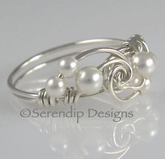 Wire Wrapped Sterling Silver White Pearl by SerendipDesignsJewel, $24.00 Spiral White Jewelry For Wedding, White Wire Wrapped Rings For Anniversary, White Spiral Jewelry For Anniversary, Anniversary White Wire Wrapped Rings, Pearl Cluster Ring, Wrapped Rings, Silver Wrap Ring, June Birthstone Ring, Diy Wire Jewelry