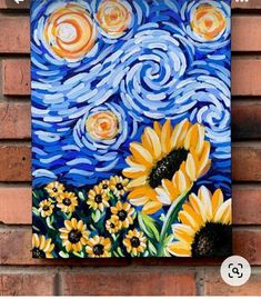 a painting on a brick wall with sunflowers in the foreground and an image of