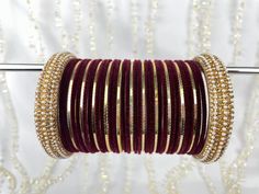 The perfect fusion of tradition and style, designed to elevate your outfit with elegance and charm. This stunning bangle set offers the versatility you've been searching for, as it can be tailored to adorn one hand, ensuring that you shine in any setting. This set includes a total of 24 colored bangles, carefully selected to complement a wide range of outfits and moods. 2 stunning Kara bangles add a touch of mystique and allure to your ensemble, and 11 plain insert bangles, offering a clean and classic finish to your overall aesthetic. NOTE: Bangle sets are fully customisable!! If you wish to change the colour of this bangle: 1. Choose a colour from the plain bangle section from our shop page. 2. Take a screenshot of the bangle set  3. send us a message, please note your order name, the sc Adjustable Bangle Bracelet For Diwali, Adjustable Round Bangle For Diwali, Adjustable Bangle For Diwali, Traditional Festive Stackable Bangle, Elegant Adjustable Bangle For Diwali, Traditional Festive Stackable Bracelets, Festive Traditional Stackable Bracelets, Elegant Adjustable Bangle For Festivals, Adjustable Hand-set Bangle For Celebrations