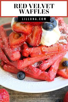 red velvet waffles with blueberries and strawberries on top