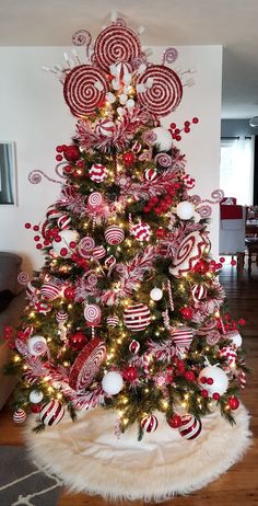 a christmas tree decorated with candy canes and candies