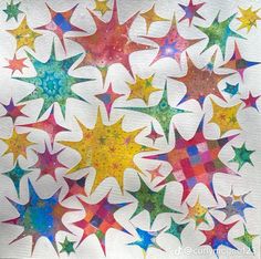 a painting of many different colored stars on a white paper sheet with watercolor paint