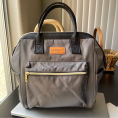 a gray purse sitting on top of a table