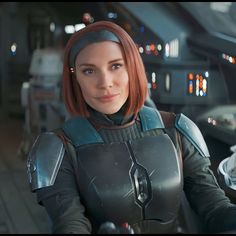 a woman with red hair in a sci - fi setting, looking at the camera