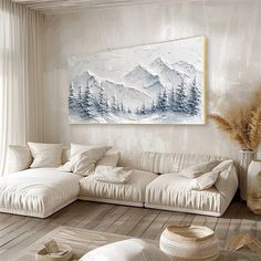 a living room with white furniture and paintings on the wall