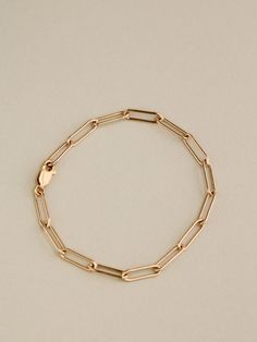 A bold paperclip style chain with elongated oval links and a strong classic lobster clasp. Pictured here with the Paperclip Chain Necklace. Luxury Yellow Gold Paperclip Bracelet With Box Chain, Luxury Gold Plated Classic Paperclip Bracelet, Paperclip Chain Necklace, Elongated Oval, Instagram Jewelry, Chain Loop, Stackable Bracelets, Gold Bracelet Chain, Paper Clip