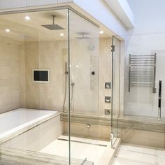 a bath room with a stand up shower and a tub