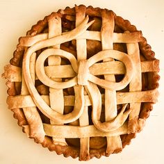 an apple pie with latticed crust on top