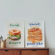 two boxes of fresh bagel sitting on top of a dresser