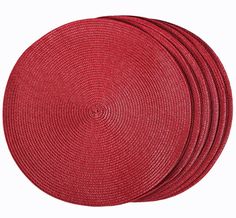 four red placemats stacked on top of each other