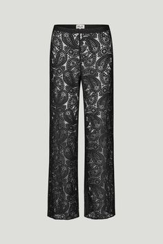 Elevate your style with these bold black lace pants. Featuring an intricate pattern, these pants offer a unique blend of sophistication and daring. Perfect for a night out or a chic daytime look, they pair effortlessly with any top. Chic Lace Bottoms For Evening, Chic Lace Evening Bottoms, Evening Pants With Lace Trim, Wide Leg Pants With Lace Trim For Night Out, Black Lace Trim Pants For Party, Chic Black Pants With Lace Trim, Evening Black Bottoms With Lace Trim, Black Lace Trim Bottoms For Evening, Chic Pants With Lace Trim For Night Out