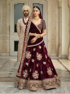 This dark burgandy colour wedding lehenga set is inspired by Sabyasachi Collection. Lehenga set is in velvet silk fabric with zardozi, marodi and arri hand embroidery. This lehenga set comes with one velvet shawl and one net dupatta as shown in the photo. Bridal Lehenga Collection, Designer Bridal Lehenga, Indian Bridal Lehenga, Bridal Lehenga Red, Red Lehenga, Indian Bridal Dress, Indian Bride And Groom, Indian Bridal Wear, Designer Baby