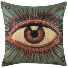 a decorative pillow with an eye on it