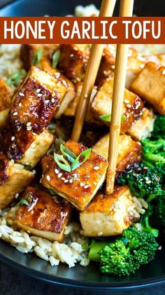 a plate with tofu, broccoli and rice topped with chopsticks