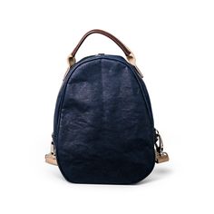 a blue handbag on a white background with a brown handle and strap around it