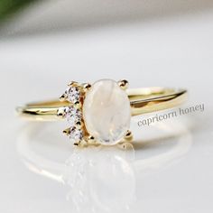 Gemstone Stacking Ring | Natural Moonstone | 14K Gold Vermeil Ring | Moonstone Engagement Ring | Promise Ring | June Birthstone | Anniversary Gift | Birthday Gift For HerChloe is a beautiful natural oval moonstone ring with three delicate CZ details on its side. This ring would be a perfect ring to stack alongside your other favorites or alone. It is petite while still alluring under any light. Limited time only. Use code MOONSTONE30 to receive 30% off. + Natural Oval Moonstone + 14K Gold Plated