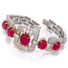 "Completely adore the deep purplish red hue of this GIA Ruby Diamond 18K Gold Oval Cabochon Bracelet! This bracelet is majestic and romantic, showcasing 5 translucent oval cabochons. The rubies are encompassed with genuine round and baguette cut diamonds, forming various square type halos. The clasp is insert clasp with a safety lock for your security and comfort. Gemstones: 5 Rubies weighing approx. 25.30 carats, Heated, Oval Cabochons, Purplish Red, Translucent, Claw Prong Set. Natural Diamond Cabochon Bracelet, Art Deco Bracelet, Rene Lalique, Yellow Gold Wedding Band, Sparkly Jewelry, Claw Prong, Cartier Jewelry, Baguette Cut Diamond, Fabulous Jewelry