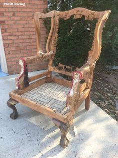 an old wooden chair sitting on top of a sidewalk