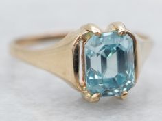 an image of a ring with a blue stone in it