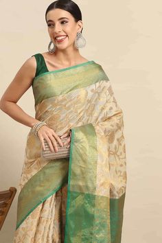 Product Features: Saree: Saree as seen in picture - Choose the drape style while order: Standard, Pleated or Gujarati Saree Color: Green Saree Fabric: Banarasi Art Silk Saree Style: Banarasi Saree Work: Floral Saree Pattern: Regal Weave Saree Print: floral zari woven Blouse: Blouse design must be chosen while ordering. For the blouse in pic, please choose the selection "As seen in picture" or customize your selection. Blouse Color: Green Blouse Fabric: Banarasi Art Silk Blouse Print or Pattern: Tissue Silk Dupatta For Navratri, Designer Tussar Silk Pre-draped Saree, Festive Pre-draped Chanderi Saree, Anarkali Pre-draped Tussar Silk Saree, Pre-draped Saree For Puja Festivals, Diwali Pre-draped Tussar Silk Saree, Zari Work Banarasi Silk Pre-draped Saree, Pre-draped Katan Silk Saree With Pallu, Bollywood Style Tussar Silk Pre-draped Saree