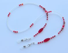 "Beautiful glasses chain made using vintage red glass beads and tiny glass seed beads.  The chain measures approximately 28\" in length and is finished with rubber glasses ends to securely attach your glasses to. Wrapped in tissue paper and presented in an organza pouch." Adjustable Red Czech Glass Beads, Red Jewelry With Lobster Clasp For Festivals, Red Beaded Chain Jewelry For Festival, Red Adjustable Necklaces With Lobster Clasp, Red Beaded Glasses Chains As Gift, Red Adjustable Necklace With Lobster Clasp, Red Beaded Glasses Chains For Gift, Adjustable Red Necklace With Lobster Clasp, Adjustable Red Beaded Necklace With Lobster Clasp