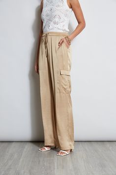 Luxe Washed Satin lends a chic patina and expression to the season's must have Cargo Pant. The elastic waist, cargo pocket details & fluid leg are the definition of sporty cool. Get ready for the compliments. Elie Tahari Exclusive Satin Cargo Pants 100% Polyester Relaxed Fit; Runs Long Model is 5'9" and wearing size 4 Measurements: Front Rise 11.25"L; Inseam 33"L (approx. length for size S) Dry clean Imported Style #: E4027204 Chic Full-length Bottoms With Cargo Pockets, Chic Full-length Summer Cargo Pants, Chic Wide-leg Parachute Pants With Cargo Pockets, Chic Cargo Pocket Parachute Pants For Spring, Chic Parachute Pants With Cargo Pockets For Spring, Chic Cargo Parachute Pants For Spring, Chic Wide Leg Bottoms With Multiple Pockets, Chic Cargo Style Long Bottoms, Chic Cargo Style Long Pants